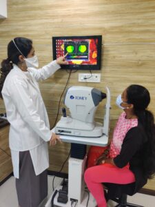 Doctor showing Corneal Topography Test